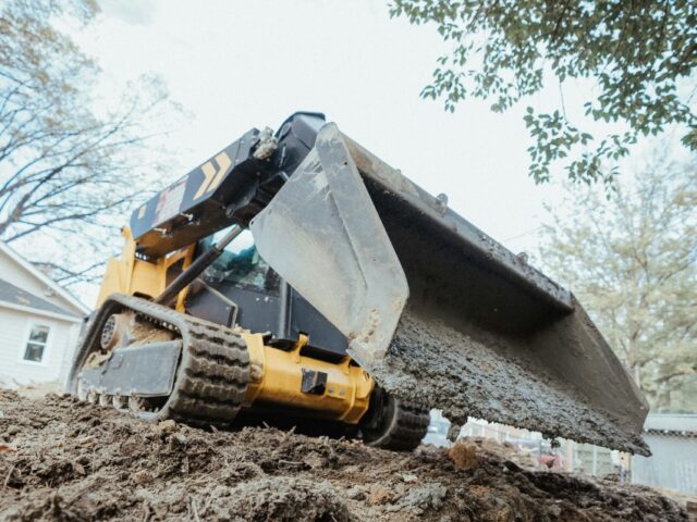 Skid steer grading uneven grounds