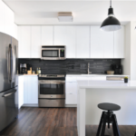 Modern kitchen remodel featuring sleek pendant lights over a breakfast bar.