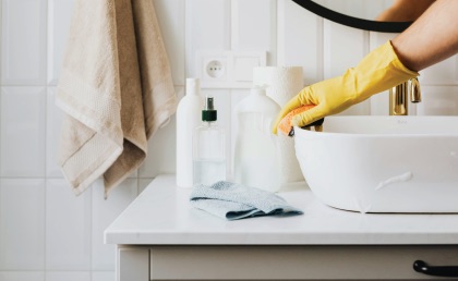 Professional cleaning team disinfecting a sparkling kitchen countertop