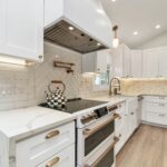 Modern kitchen remodel with sleek cabinetry, stainless steel appliances, and marble countertops