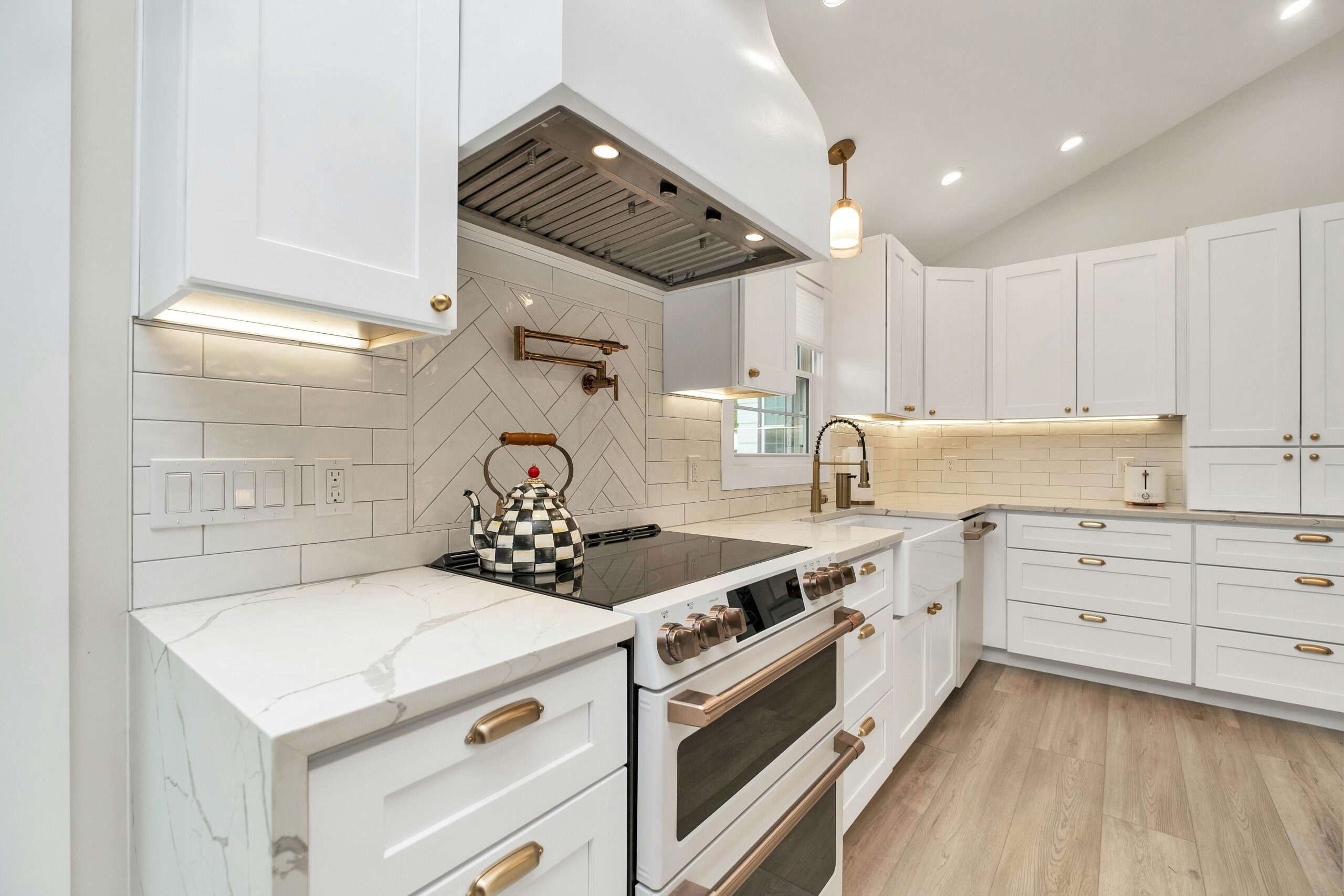 Modern kitchen remodel with sleek cabinetry, stainless steel appliances, and marble countertops